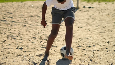 boy alone playing with the football in the ground 4k