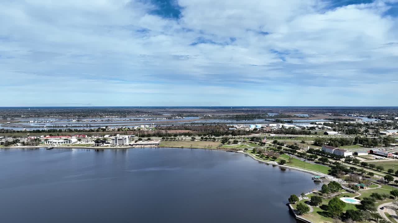 Aerial view of a busy waterfront Louisiana town on a cloudy summer day