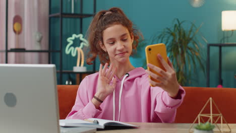 school girl blogger taking selfie on smartphone communicating video call online with subscribers