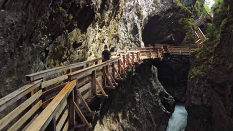 walkbridges in a gorge surrounded by waterfalls in austria