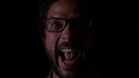 middle aged male head screaming, glasses, beard, studio portrait, close up