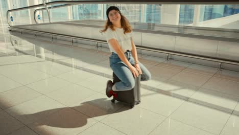 happy laughing young woman have fun in airport