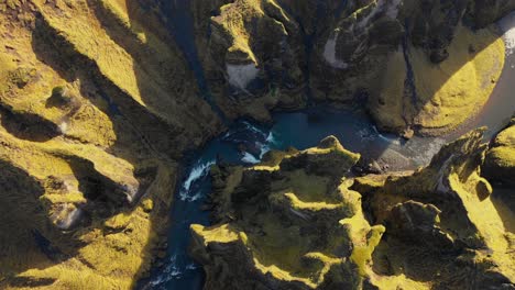 fjaðrárgljúfur canyon flyover looking down on sunny day in iceland