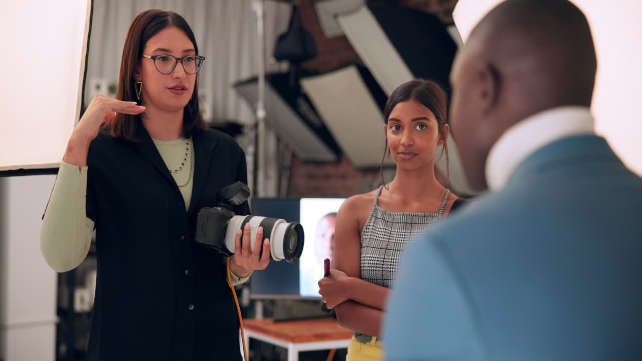 Photographer directing a photoshoot in a studio