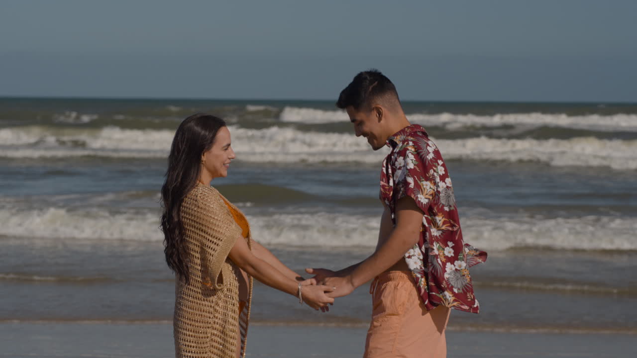 Young couple holding hands outdoors