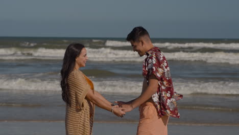 young couple holding hands outdoors