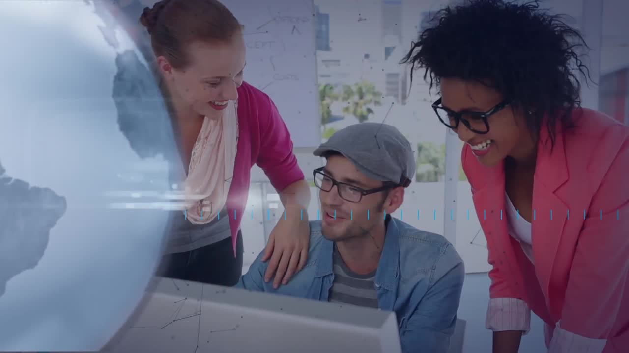Animation of globe rotating over happy diverse colleagues working together at computer