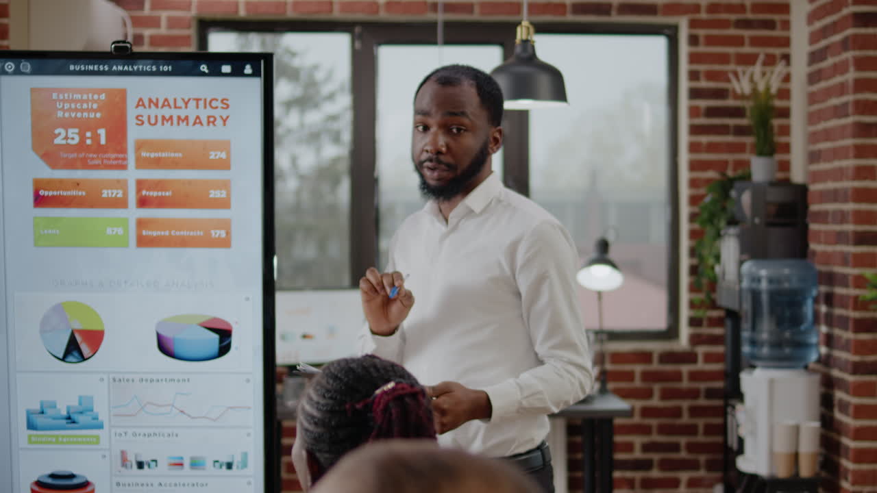 Business man using monitor to do financial presentation