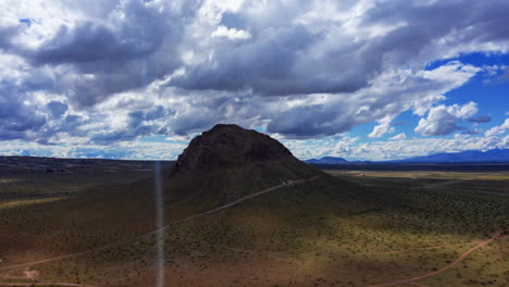 aerial hyper lapse revolving around an isolated butte, mojave desert