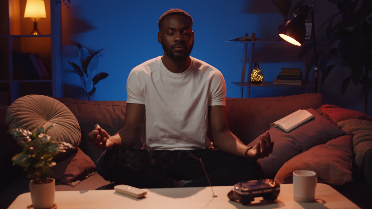 Man meditating on couch