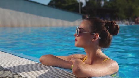 woman relaxing at the pool