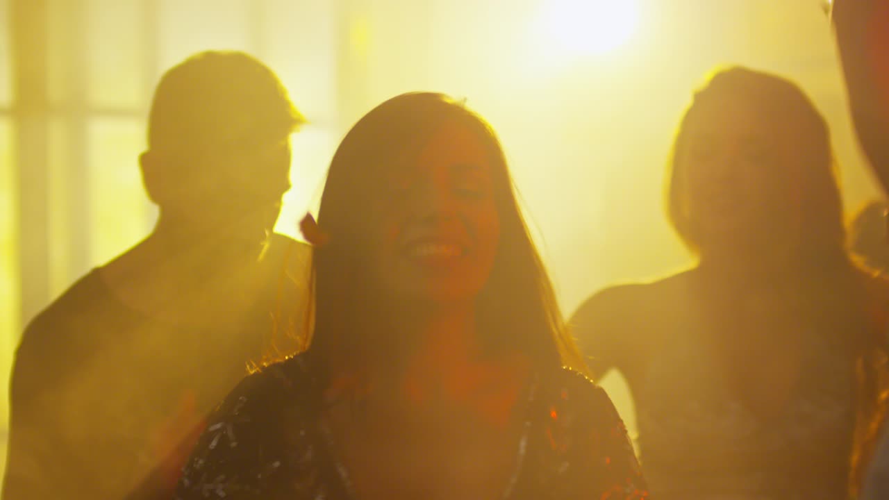 People Enjoying Music on Dance Floor