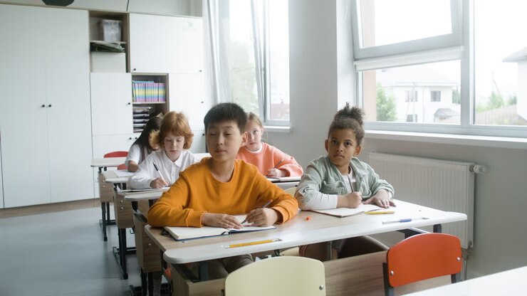 Students sitting at the classroom.