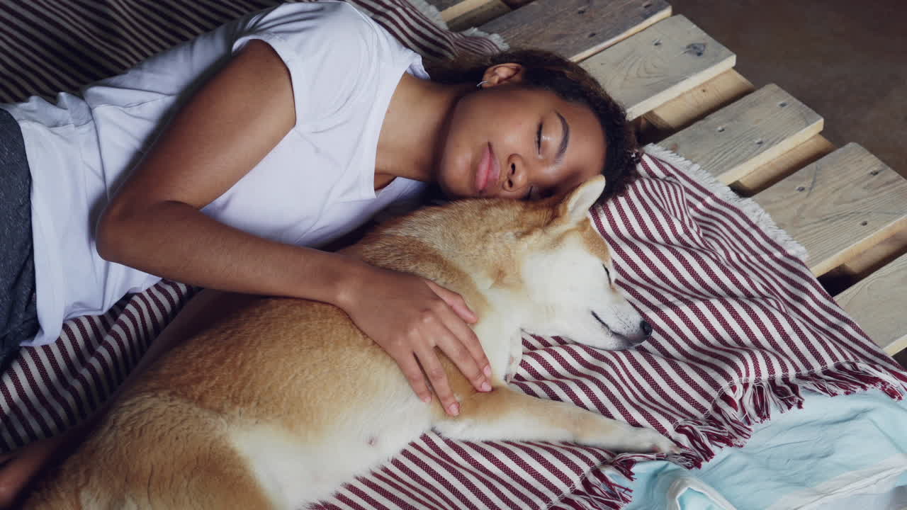 Woman and Dog Sleeping Together