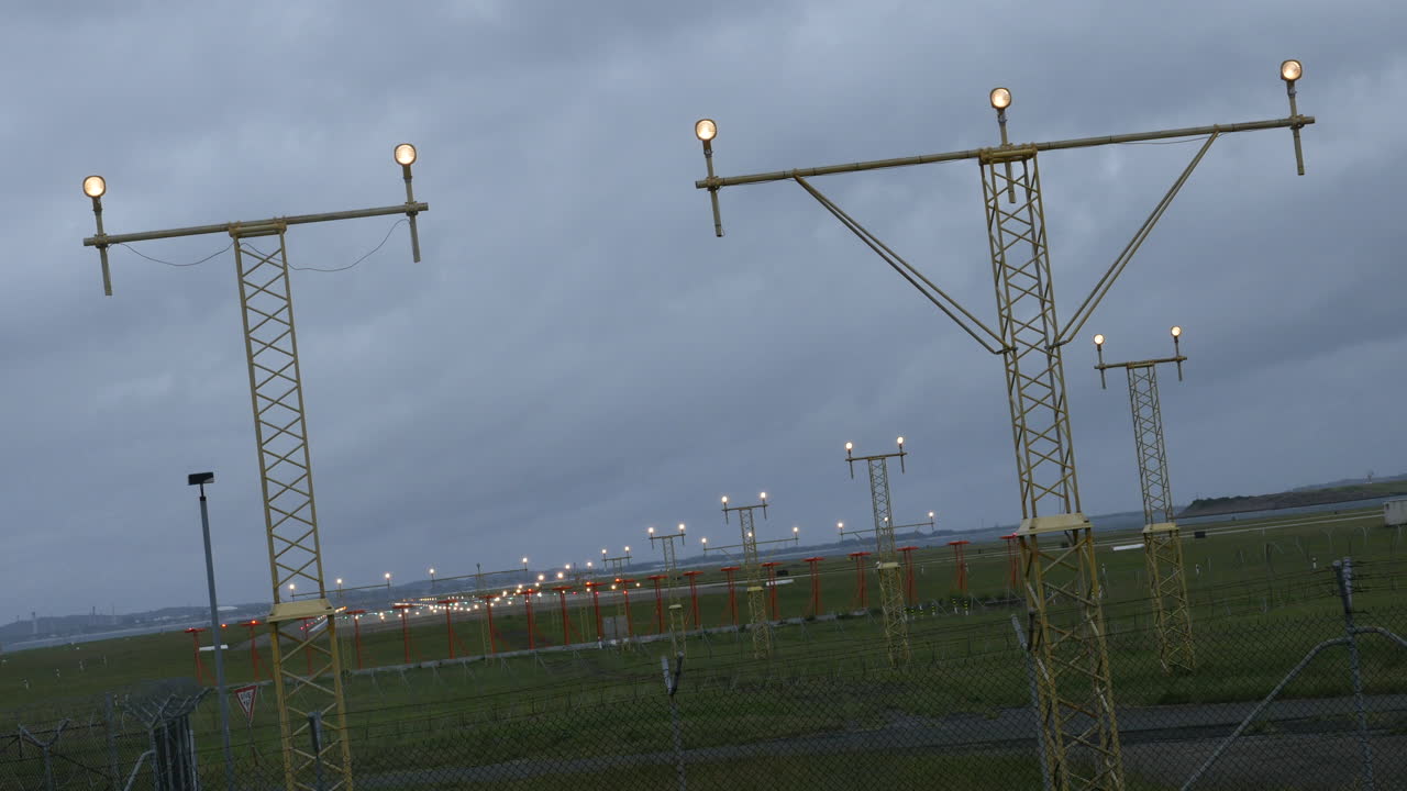 Plane coming into land at Sydney Airport Australia in gray-stormy weather shot in 4k high resolution