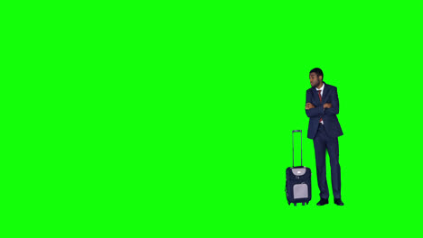 Businessman-standing-with-suitcase