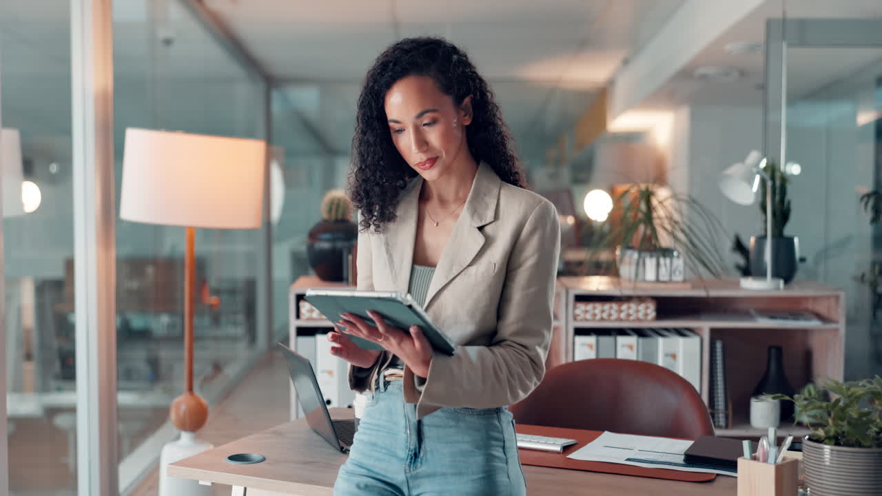 Businesswoman working on a tablet in her office