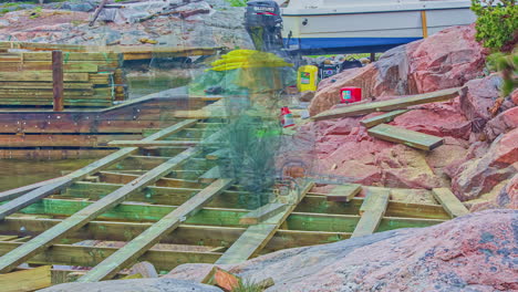 motion timelapse of manual workers building wooden platform by the shore at daytime