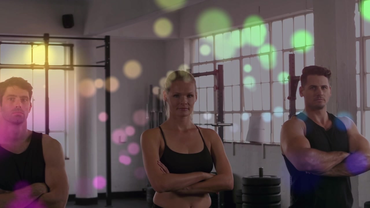 Animation of light spots over diverse people at gym