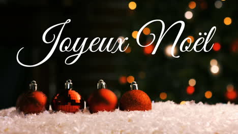 joyeux noã«l written over christmas baubles