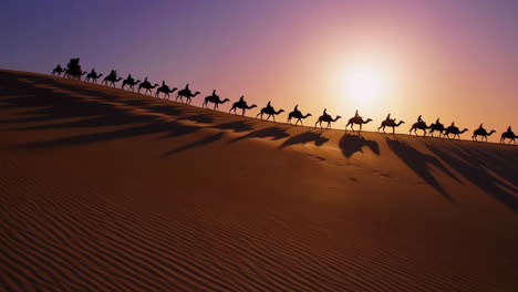 camel caravan in the desert sunset