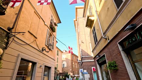 colorful flags adorn a quaint italian street