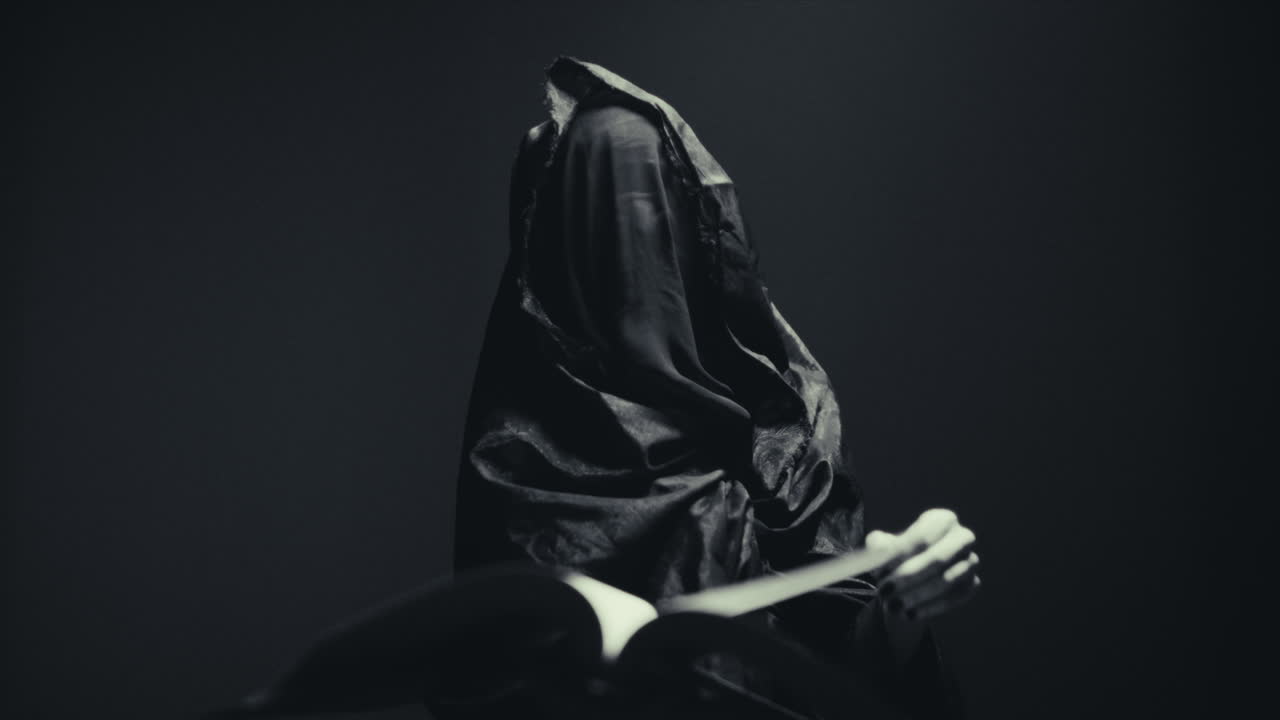 Mysterious Figure Reading a Book