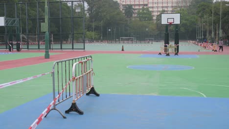 empty basketball courts are seen at a closed playground due to covid-19 coronavirus outbreak and restrictions in hong kong