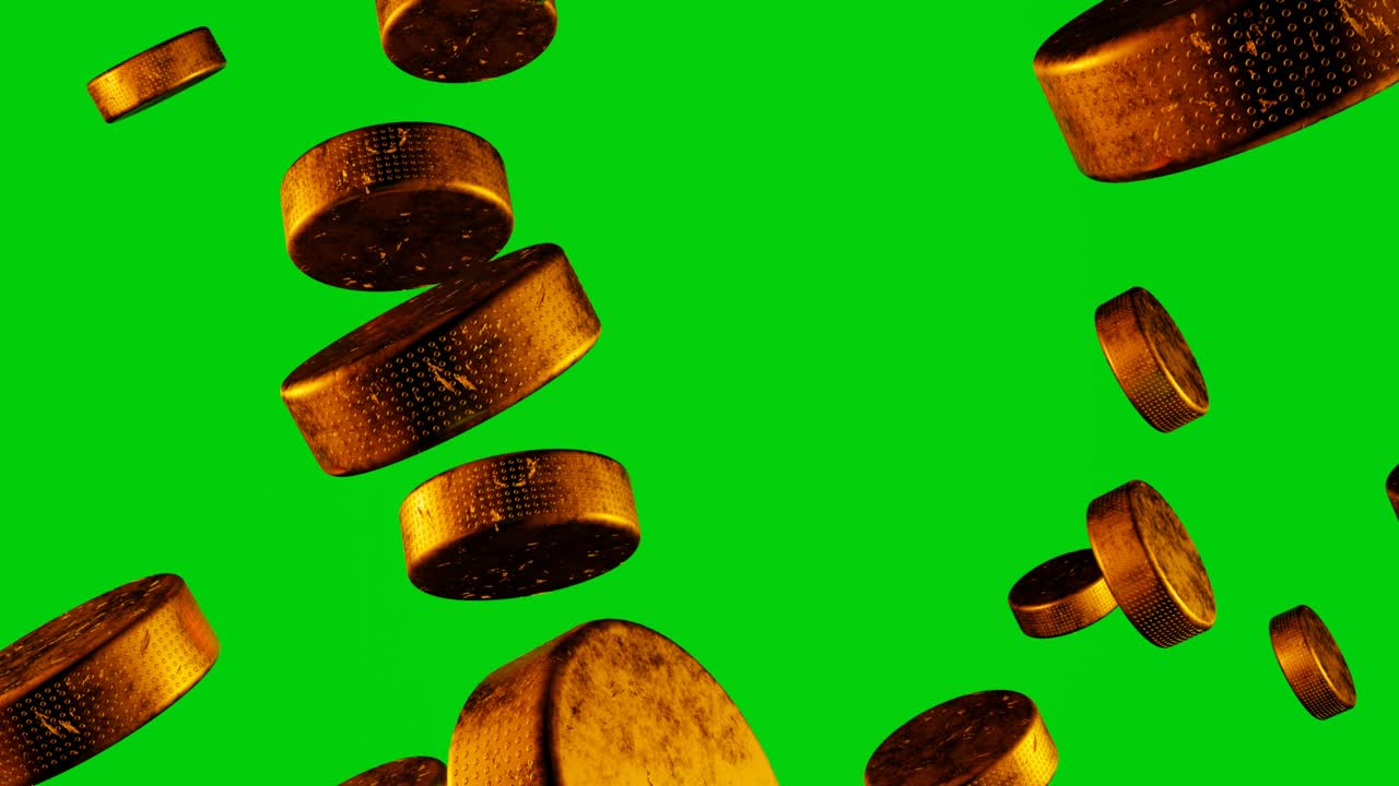 muchos pucks de hockey dorados volando a la cámara en el fondo de chromakey.