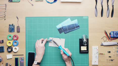 top view technician soldering solar panels green energy concept from above - red epic dragon