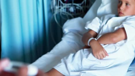 female doctor holding thermometer at hospital