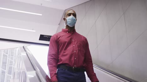 African-american-man-on-the-go-wearing-coronavirus-covid19-mask