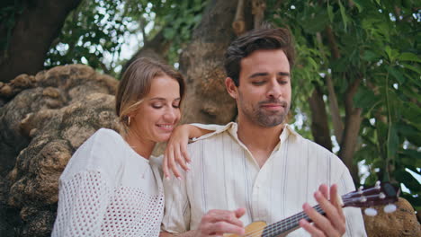 tender lovers relaxing guitar music at greenery nature closeup. romantic date
