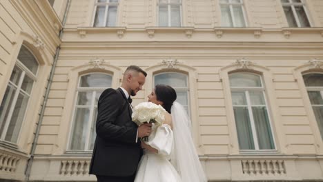 bride and groom standing together on their wedding day