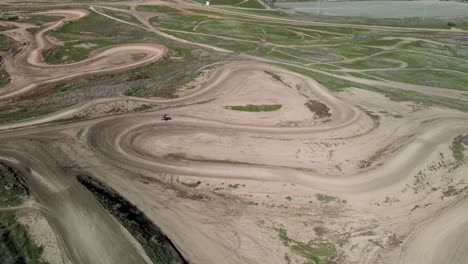 Two-dirt-bikes-cornering-on-Prairie-City-Off-Highway-motor-vehicle-recreation-at-the-foothills-of-the-Sierra-Nevada-foothills