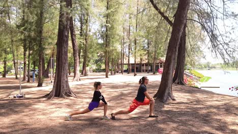 couple stretching outdoors in a park