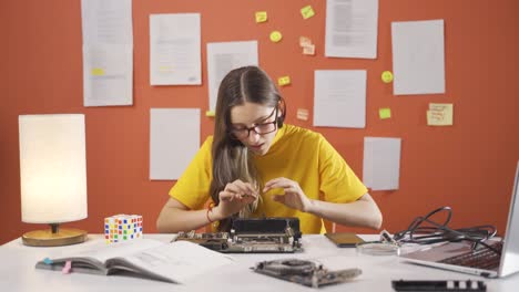 seriously smart girl child focused on tech stuff gets frustrated.