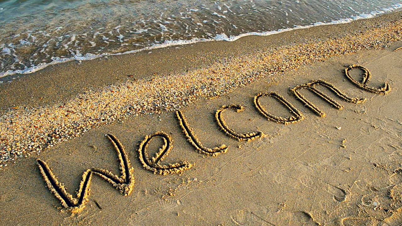 Iscrizione sulla sabbia, in spiaggia. Scatto sulla spiaggia