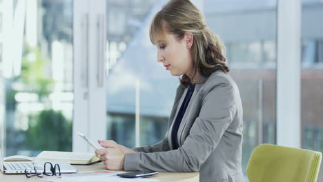 a young businesswoman working on a digital tablet