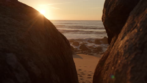 footsteps on sandy portugal beach and bright sunset, motion view