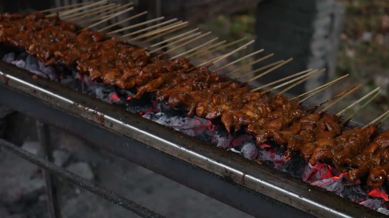 Chicken satay cooking process. grilled chicken over coals. Chicken satay is one of the favorite foods in Indonesia