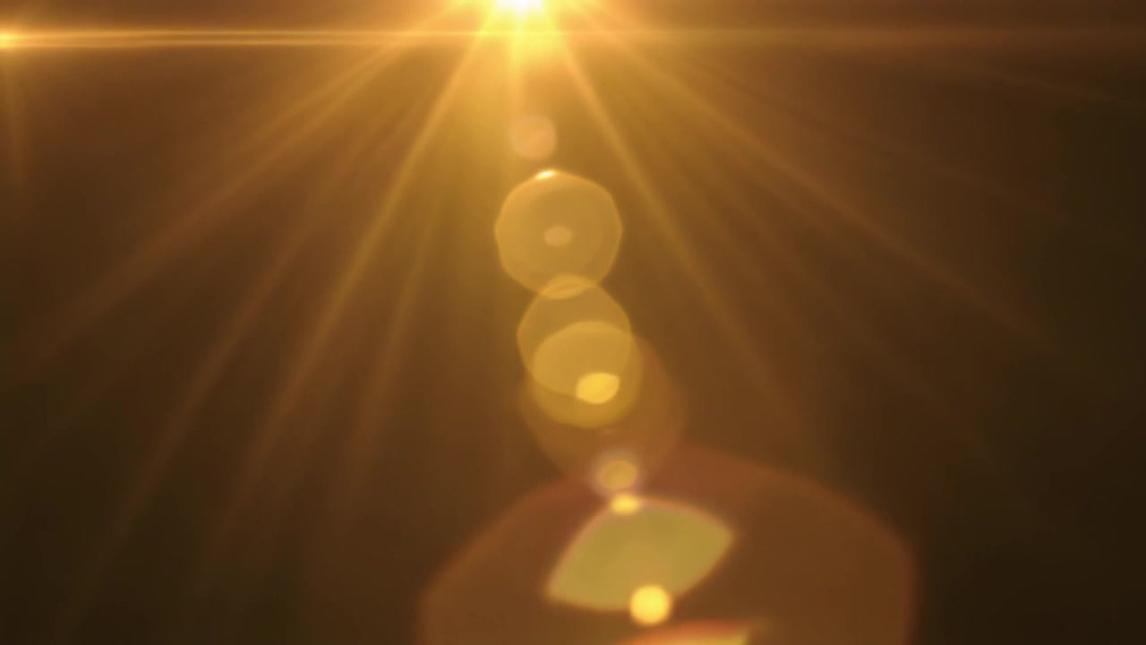 Golden Lens Flare Effect on Dark Background