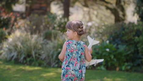 little-girl-playing-with-toy-airplane-happy-child-playing-game-running-imagining-travel-freedom-having-fun-outdoors-in-sunny-park-enjoying-childhood-4k