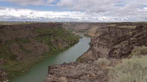 drone flying over the rim of the snake river canyon