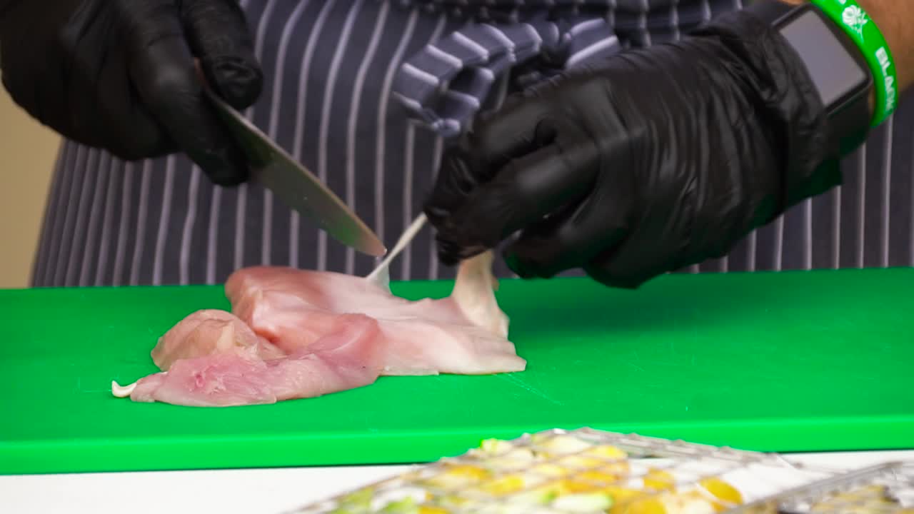 Chef Preparing Sliced Chicken Breast