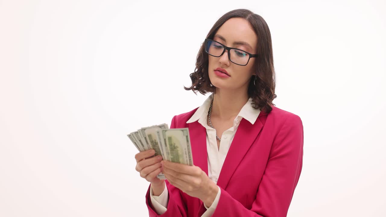 Woman in Pink Blazer Counting US Dollar Bills