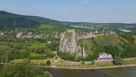 drone aerial view of devin castle near dabube and morava rivers in bratislava, slovakia on sunny day