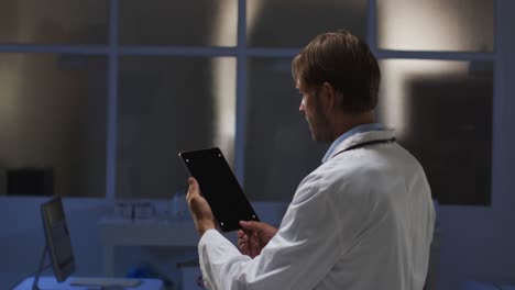 Caucasian-male-doctor-having-video-call-consultation-using-tablet-computer