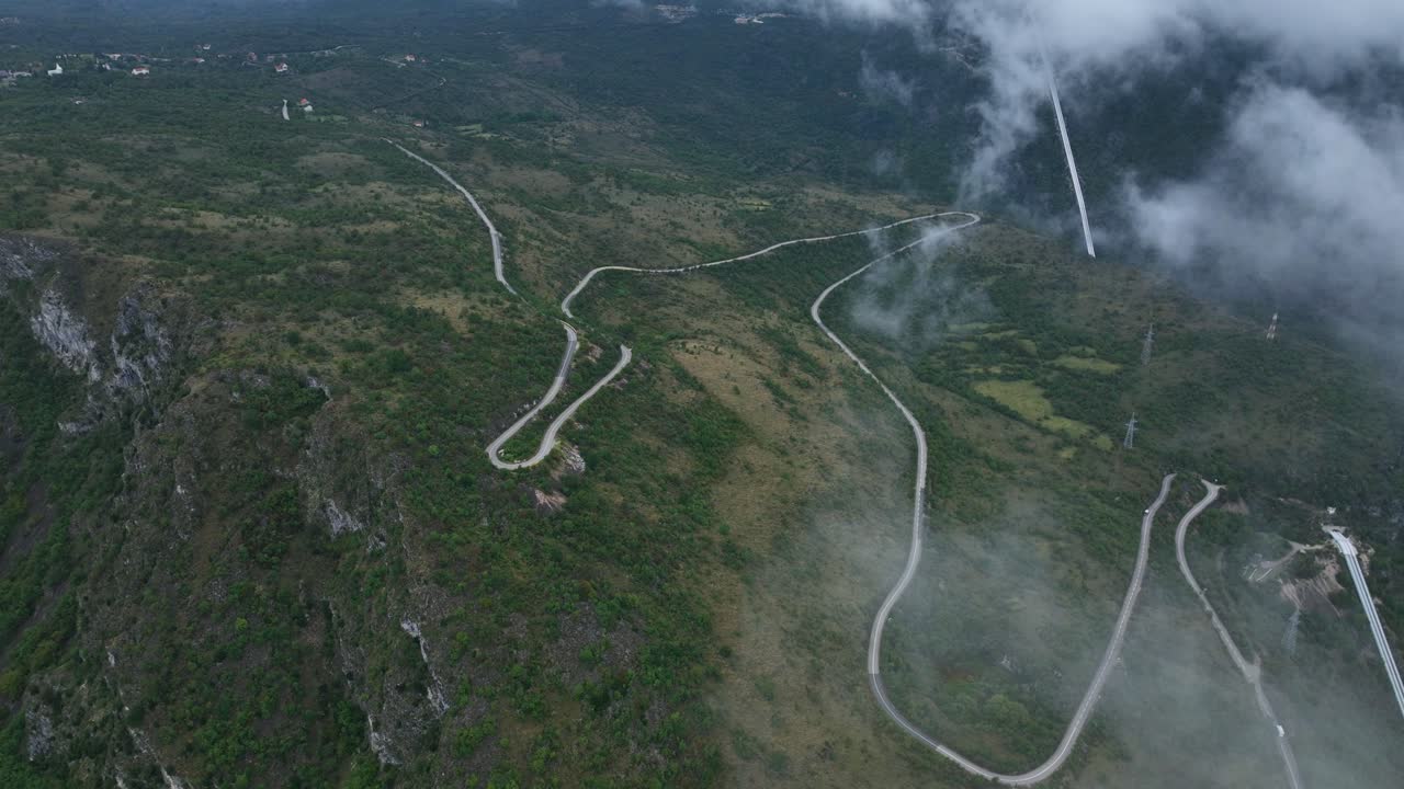 Winding Road In The Mountain On A Foggy Day In Cetinje, Montenegro. - aerialshot
