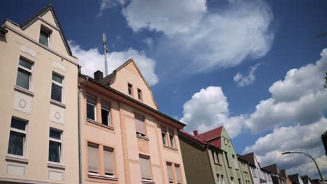 wide angle low viewpoint of generic german city apartment buildings